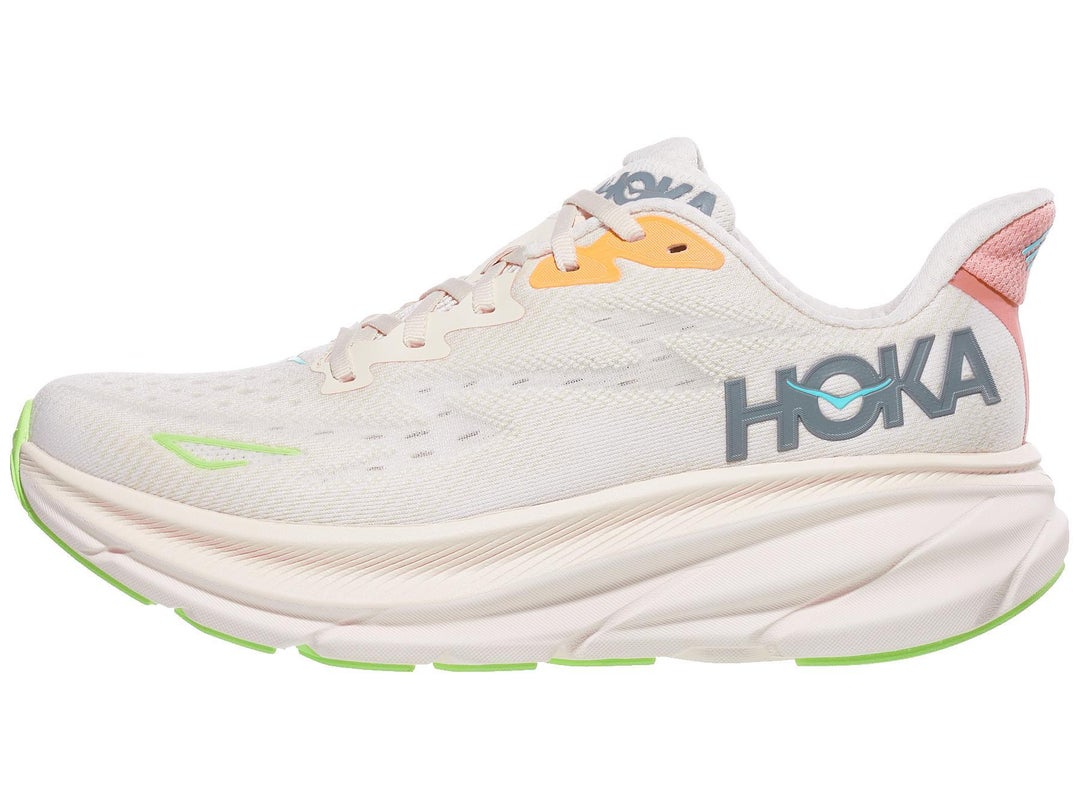 Side view of HOKA Clifton shoe in white color with small accents of grey, pink, orange, blue and neon green