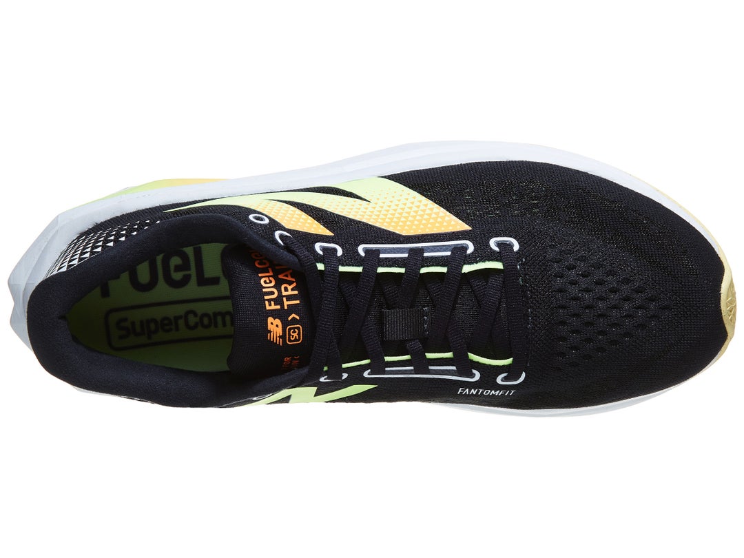 Top view of New Balance SuperComp Trainer shoe in black color with neon green and orange accents, white midsole