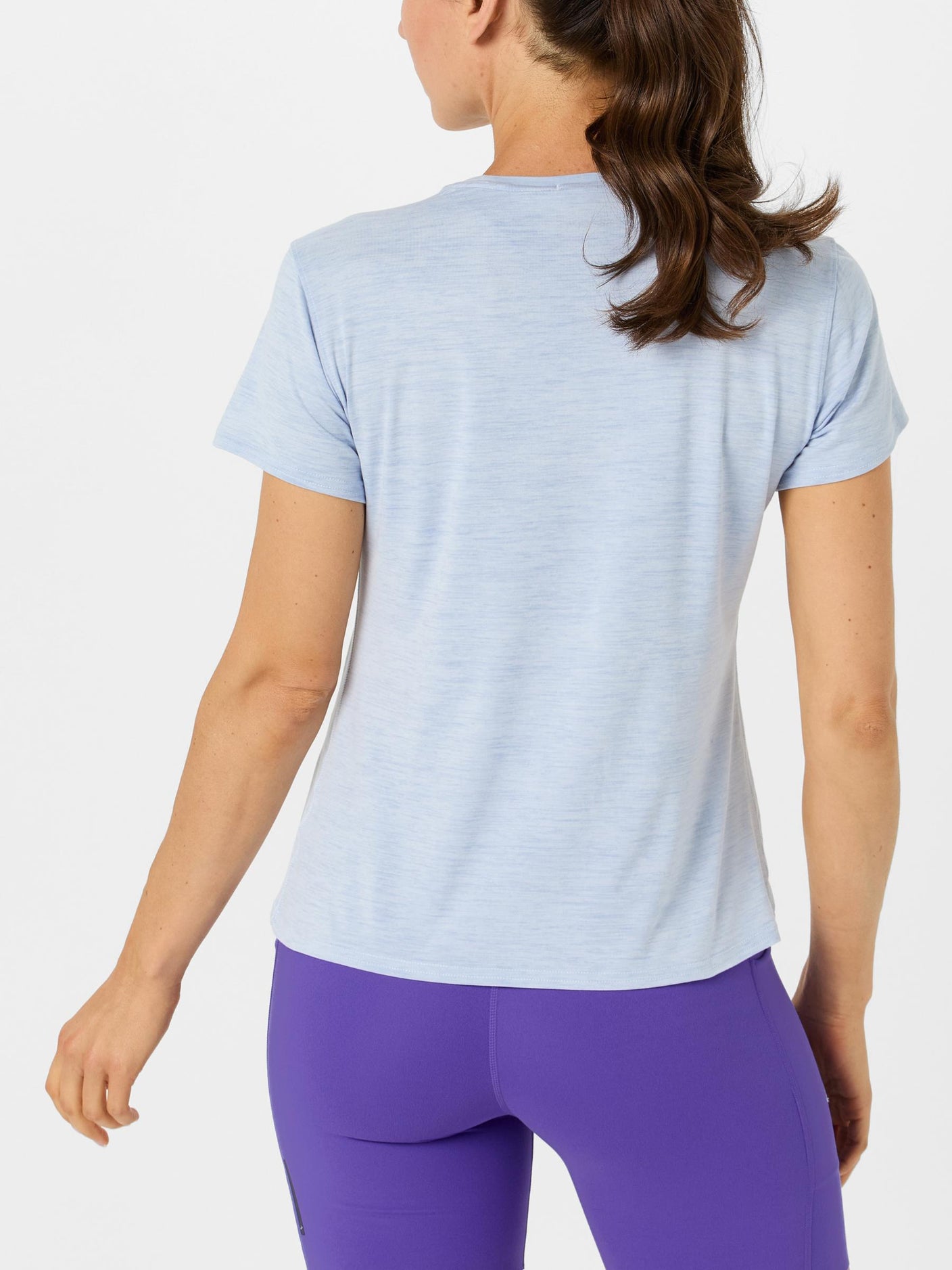 Back view of model wearing Brooks Luxe Short Sleeve in Blue color