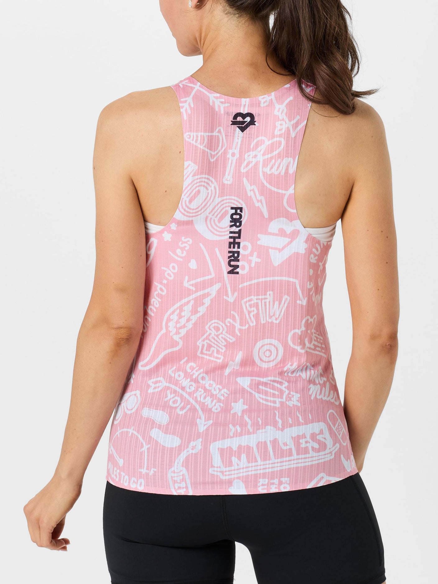 Back view of model wearing For the Run Women's Harper singlet in pink and white color