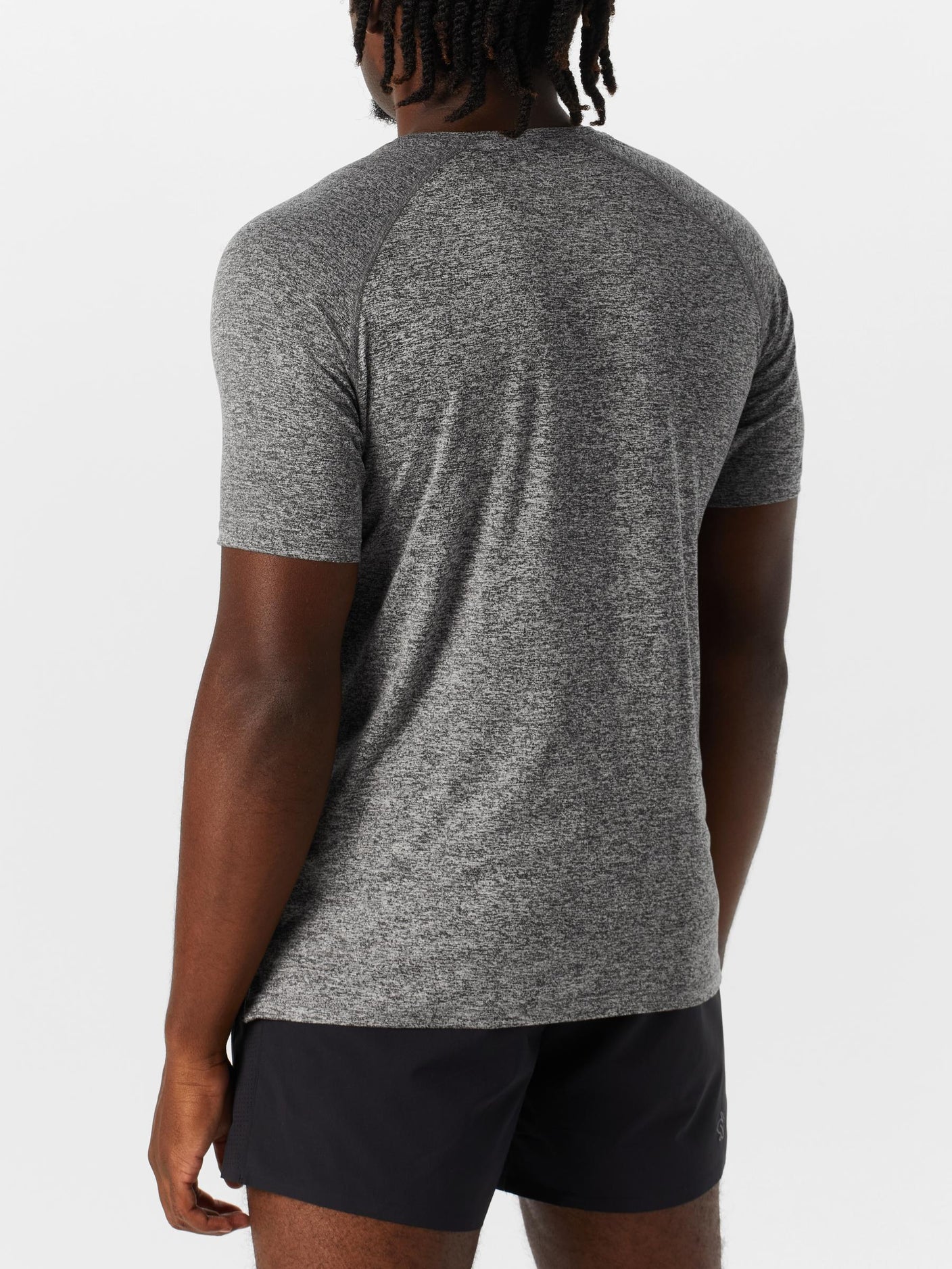 Back view of model wearing Rabbit Men's EZ Tee Short Sleeve in light gray color