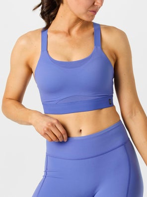 model wearing On Performance Bra in blue, front view
