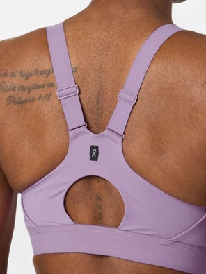 model wearing On Performance Bra in purple, back view