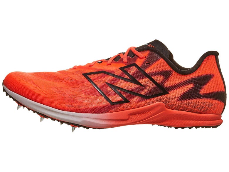 Lateral view of the New Balance FuelCell SuperComp XC-X shoe in bright orange color with black logo and accents
