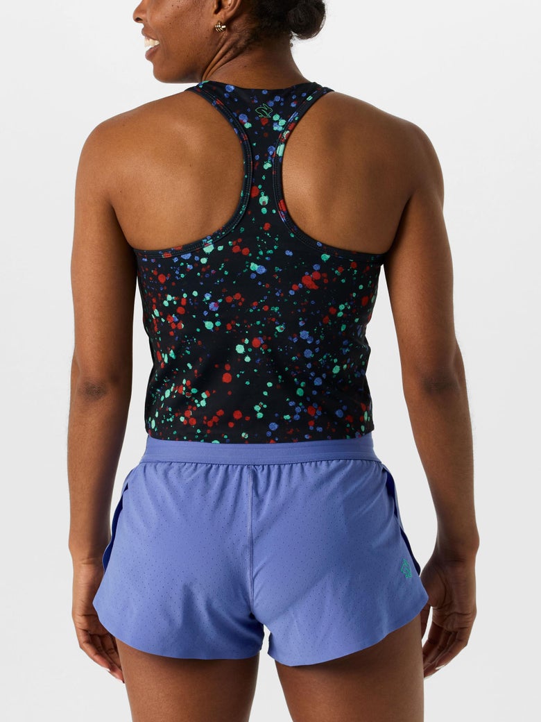 Back view of model wearing rabbit Go Time Singlet in black colorway with blue, red and light blue dotted pattern