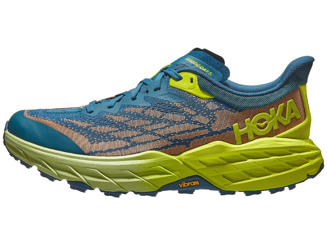 HOKA Speedgoat 5 trail running shoe. Upper is turquoise blue and orange with a neon yellow HOKA logo in the heel and a neon yellow midsole. 
