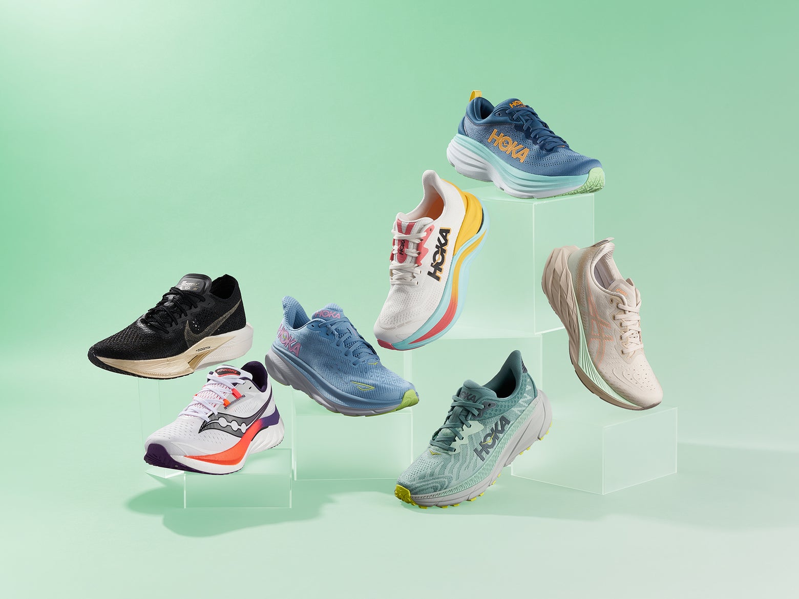 A colleciton of Running Shoes shot in a studio against a black background