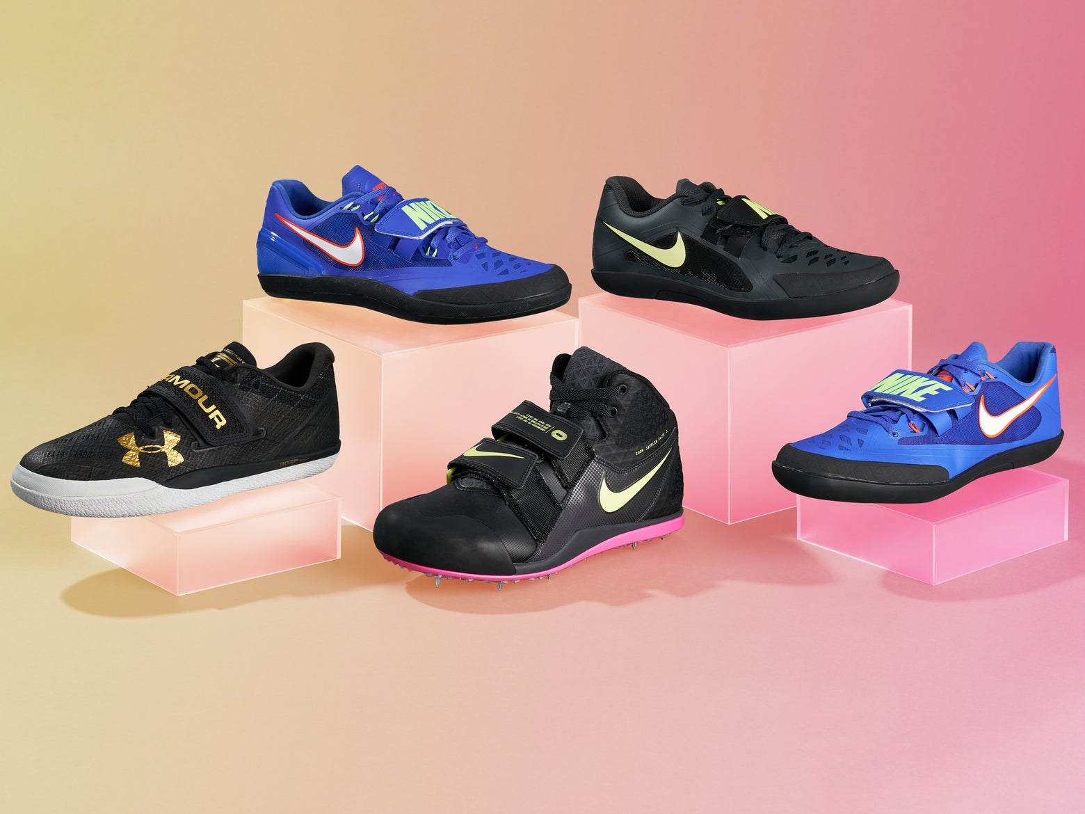 Five track and field throw shoes, including black and blue pairs with prominent logos, are displayed on pink platforms against a gradient pink and yellow background.