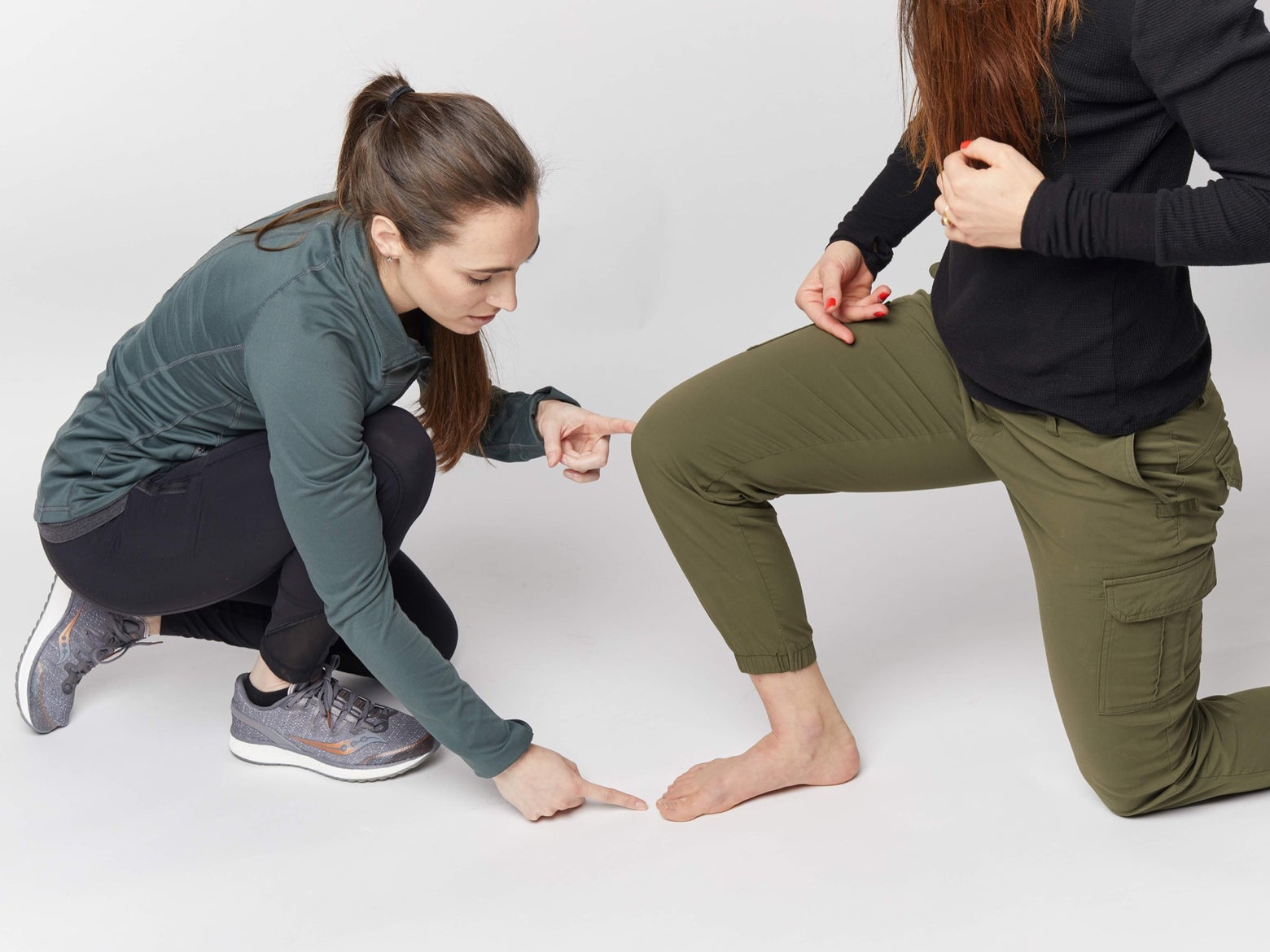 Woman pointing at Dr. Andersson's toe.