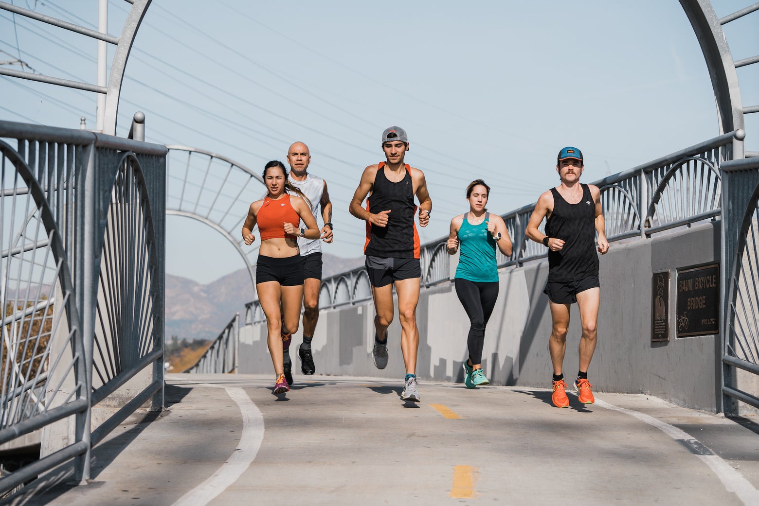 runners on a bridge