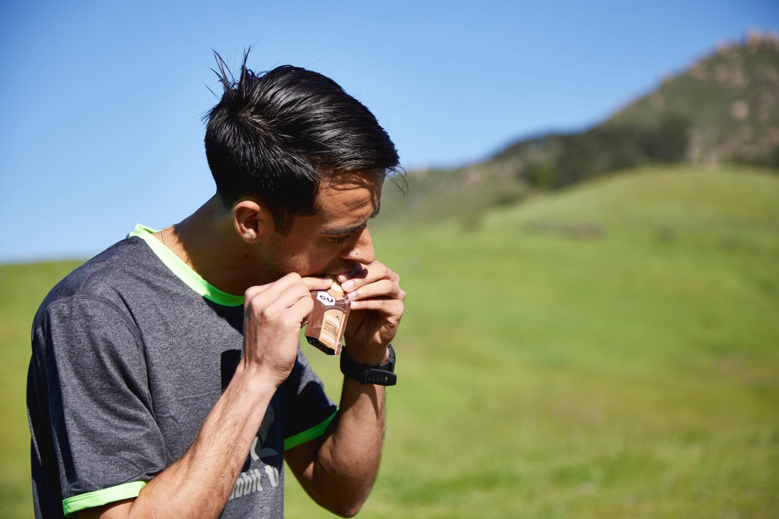 Man chewing on a GU Energy Gel
