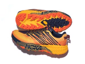 pair of shoes one sole facing out