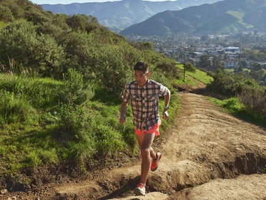 Jon from Running Warehouse wearing rabbit High Country Short Sleeve Shirt and shorts on his trail run