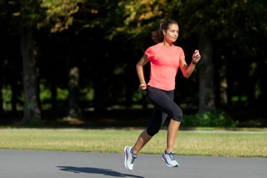 Woman running in orange t shirt