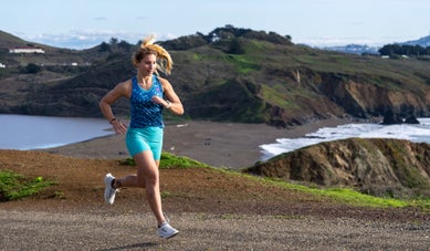 Women Running outside wearing rabbit tank and leggy shorts