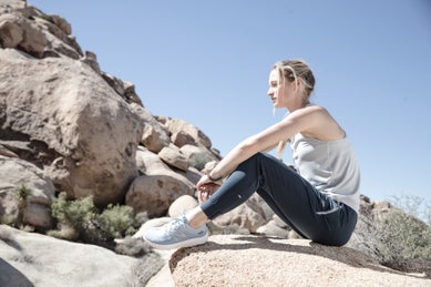 Runner resting on a rock