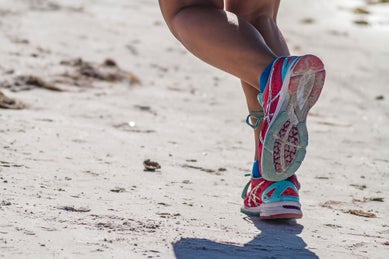 Runner tying shoes