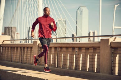 man running on bridge