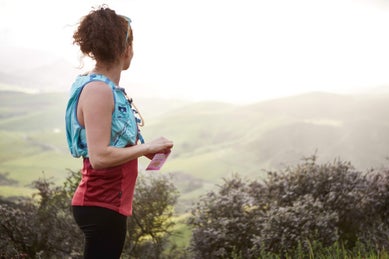 Woman opening waffle on trail