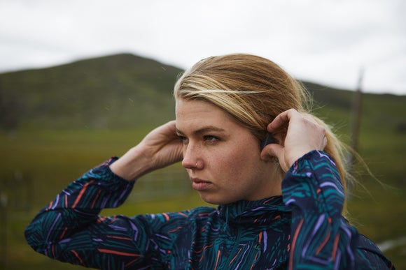 woman adjusting headphones