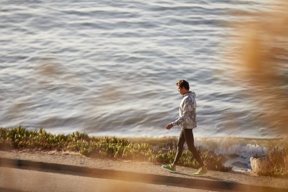 two runners leaning on each other