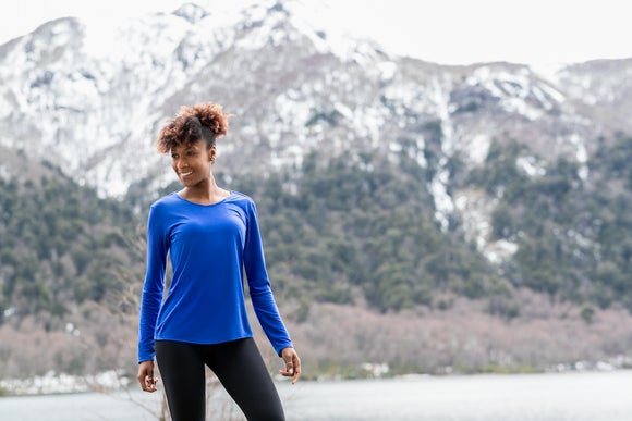 Woman running in jacket and leggings