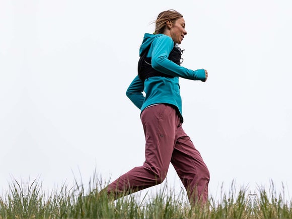 male and female runners in the snowy mountains