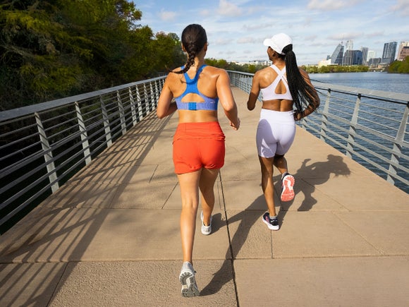 Women running in Brooks bras and shorts
