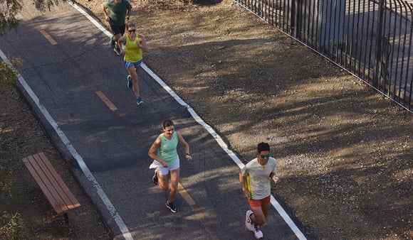 Group of runners running in the shade