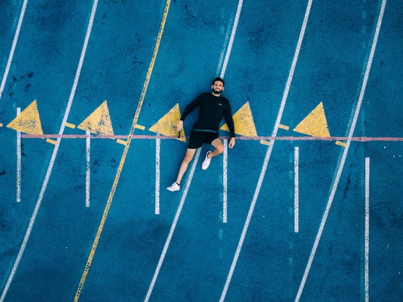 Athlete lying on track