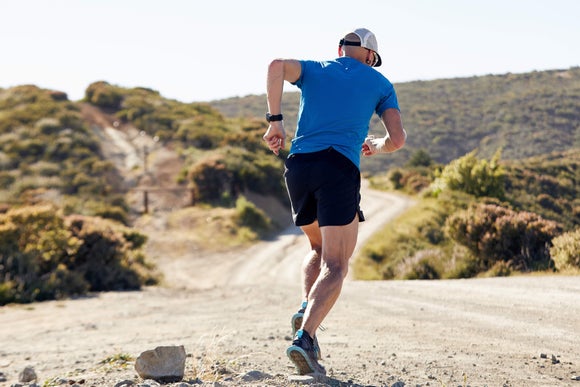 Runner on hilly dirt path