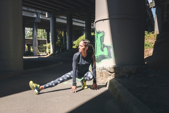 Woman Stretching before run