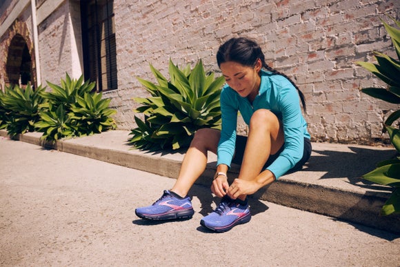 woman tying her shoelaces