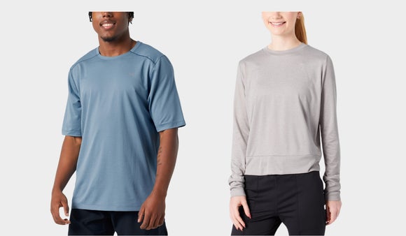 Male model wearing Arc'Teryx short sleeve tee and female model wearing Vuori Daydream Crew