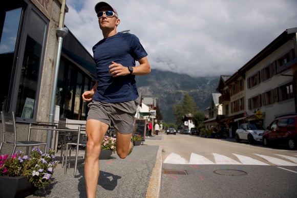 man running down street