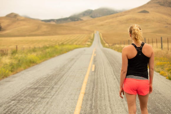 A runner looking ahead at the road