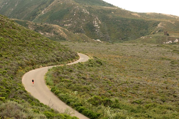 A woman running along a road