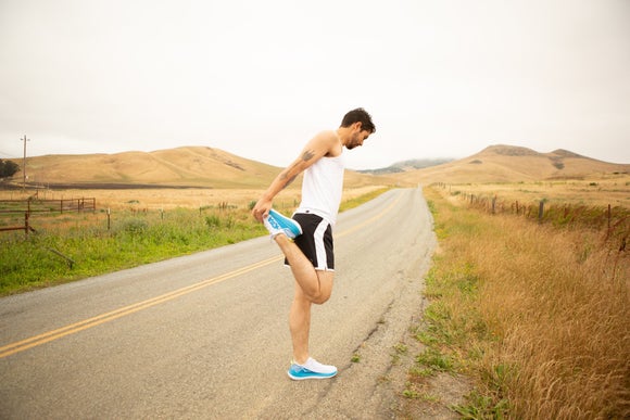 A runner stopping to stretch