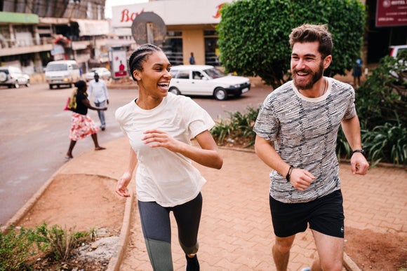 two runners laughing