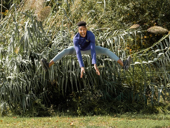 man jumping in Janji clothes