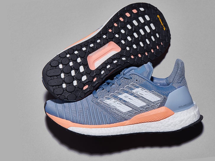 A pair of adidas Solar Boost running shoes