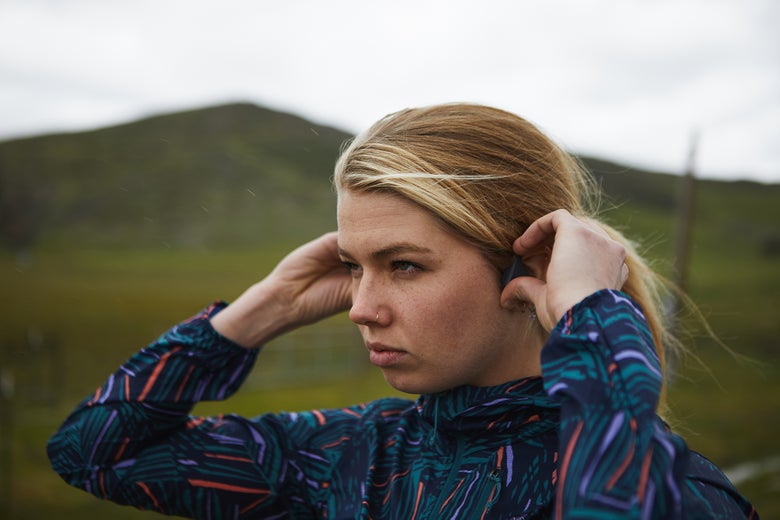 woman adjusting headphones