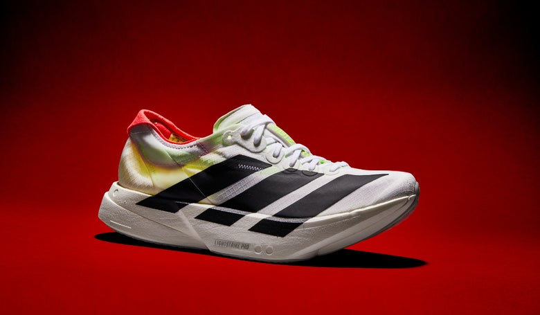 adidas adizero Adios Pro Evo 4 shoe in front of a red background