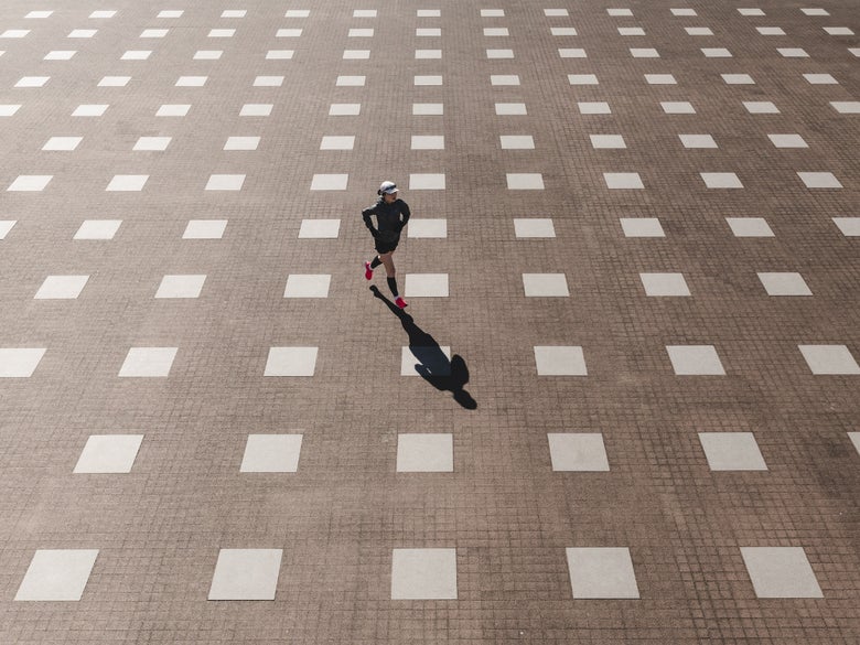 Runner running across squared grid