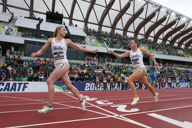 UCLA Women's distance runners completing relay exchange