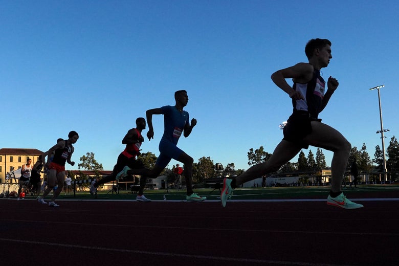 Runners in a shadow rounding a curve