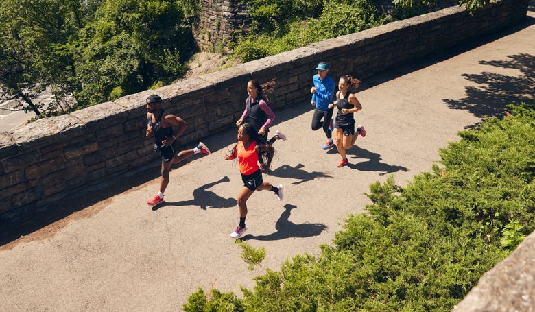 group of runners across a bridge