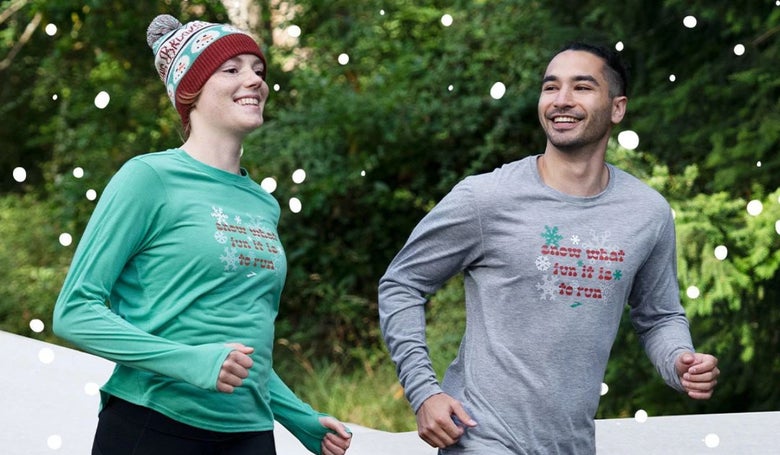 Male and female runners wearing Brooks holiday apparel