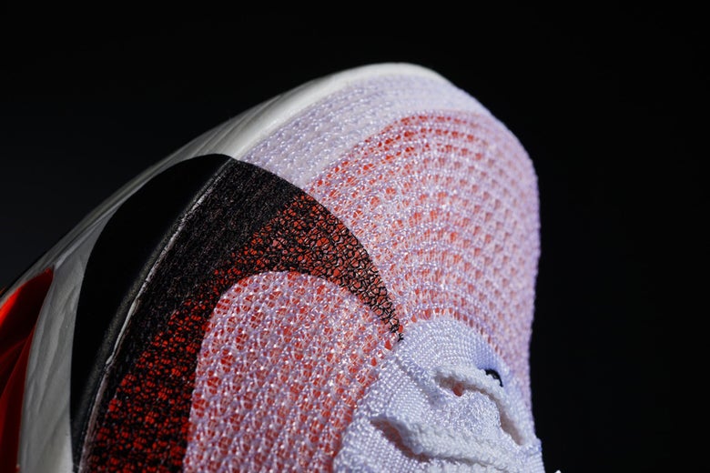 Close up view of top of toe portion of Nike shoe so show fabric mesh