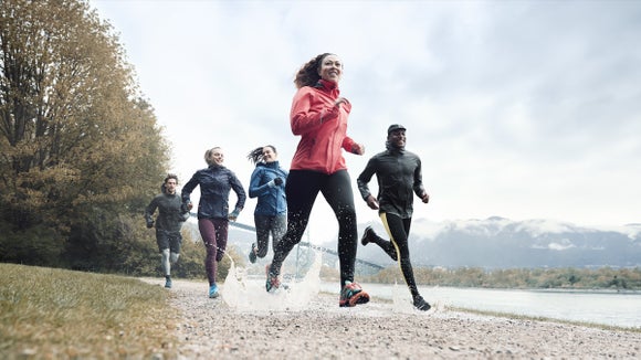 A group of runners in the rain